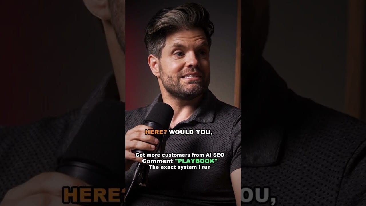Joshua Albanese speaking into a handheld microphone in a dark studio, wearing a dark polo shirt, with the on-screen caption Here? Would you, and a caption asking viewers to comment PLAYBOOK.